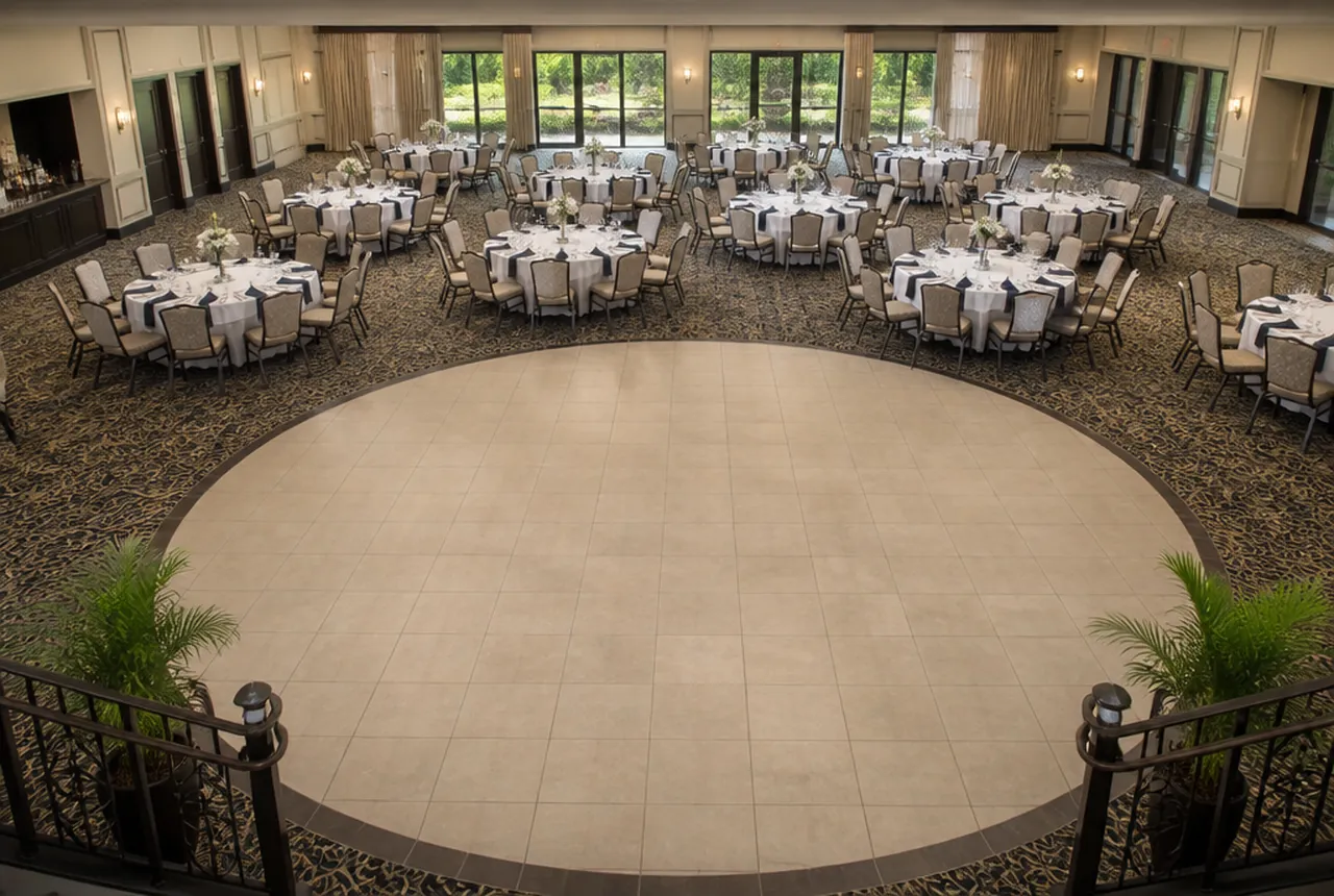 A clear circular area of open floor kept at the entry of a set banquet room for turning space