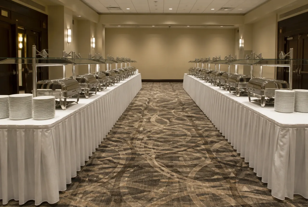 Double sided buffet line set away from the wall so guests can serve from both faces of the run